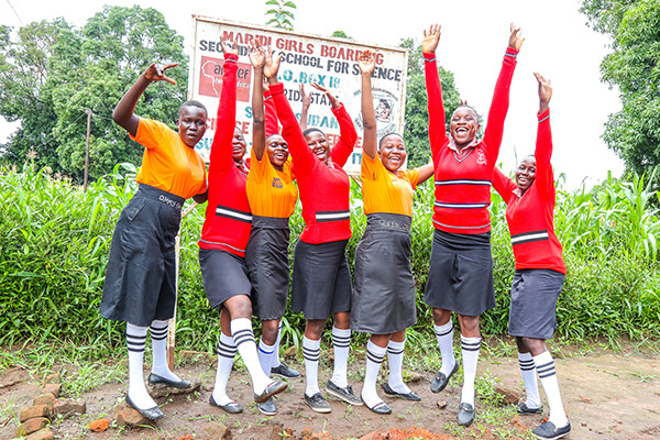 girls smiling and happy at the Maridi Girls Boarding School