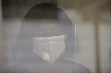 Fridah Kagwiria Kibiti, a nurse working at Nairobi Metropolitan Services wearing two masks